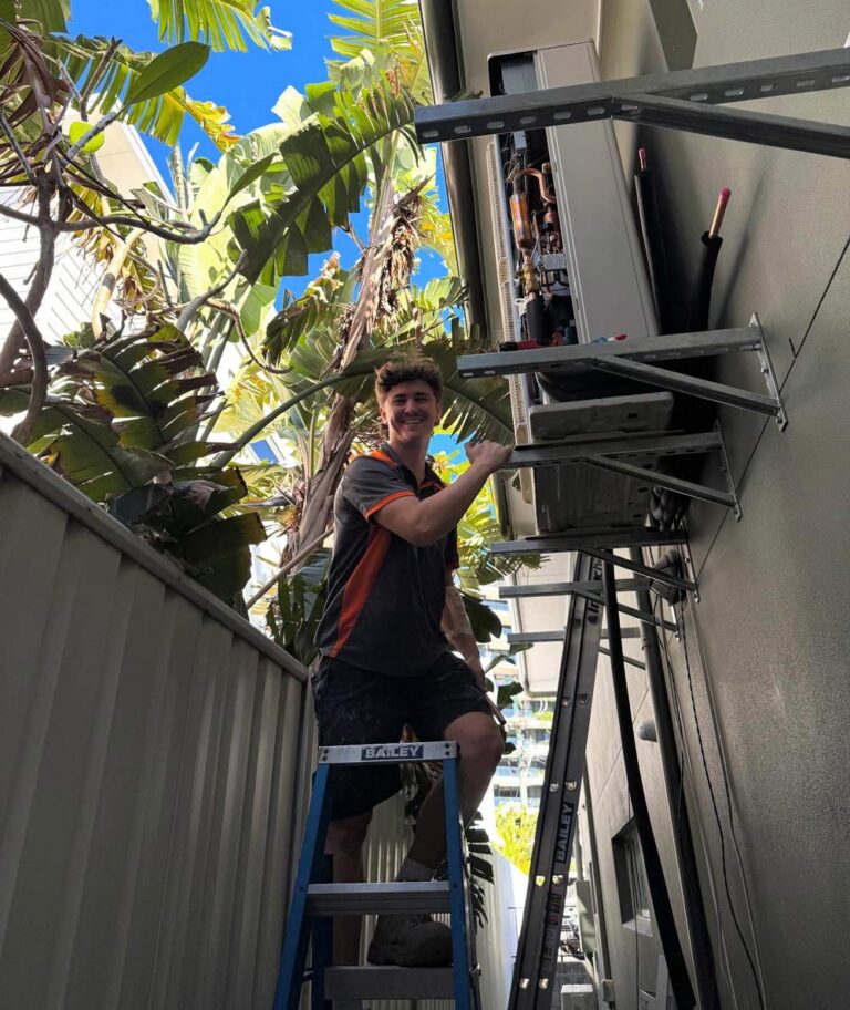 Man Doing Maintenance Warranty on Commercial Air Conditioner