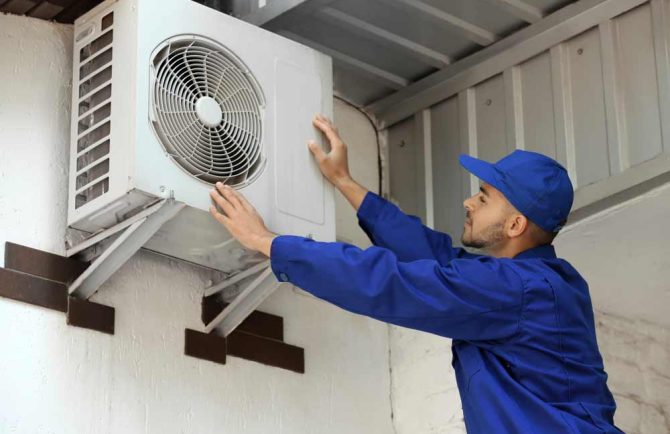 Technician Doing Air Conditioner Maintenance — Instachill in Gold Coast, QLD