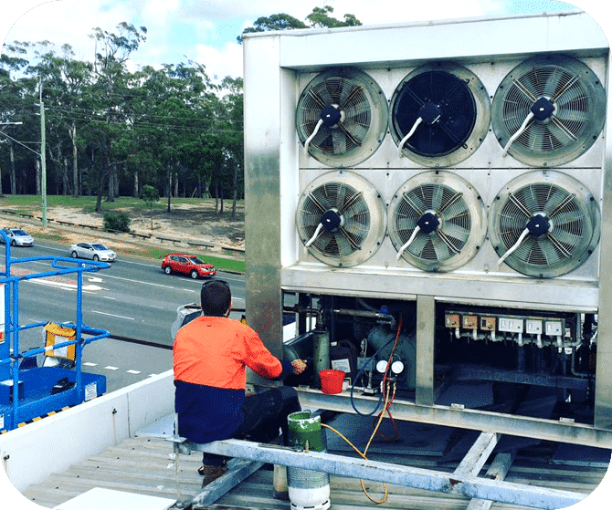 Aircon Technician Repairing Condenser — Instachill in Gold Coast, QLD