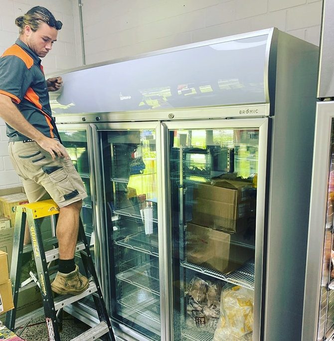 Technician Repairing Commercial Fridge — Instachill in Gold Coast, QLD